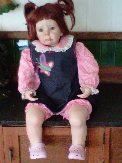 PORCELAIN DOLL WITH VERY SAD FACE & TEARS RUNNING DOWN HER CHEEKS