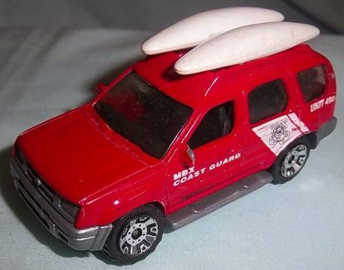 A RED NISSAN XTERRA BY MATCHBOX, 2000