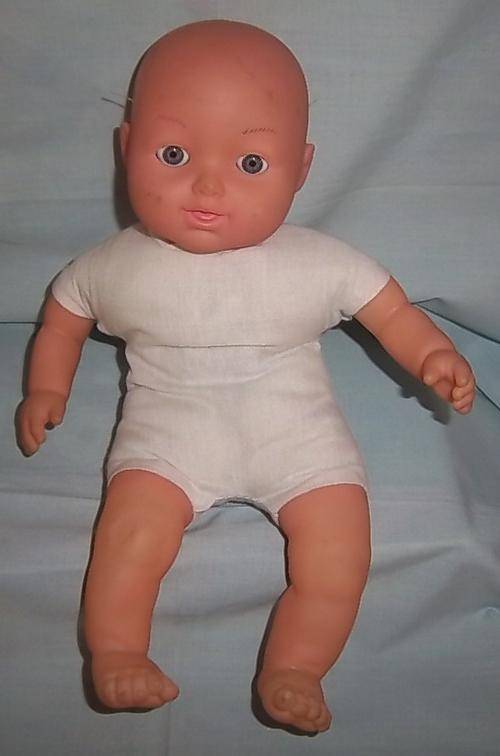A SOFT BODIED DOLL WITH EYES THAT OPENS AND CLOSES, TALKS AS WELL