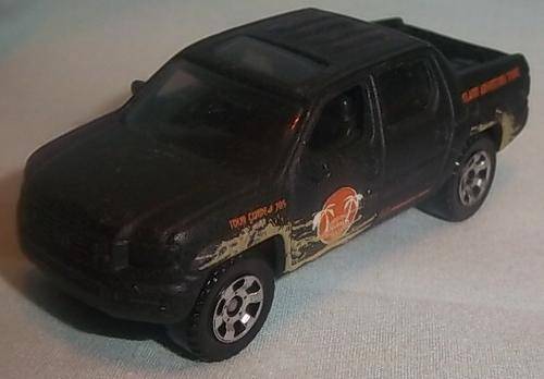 A BLACK HONDA RIDGELINE BY MATCHBOX 2006, MB705