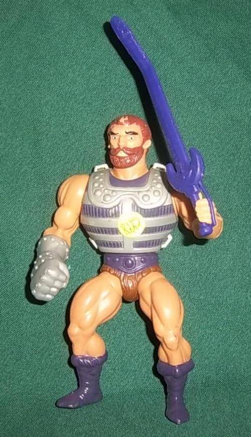 A FISTO FIGURE WITH SWORD