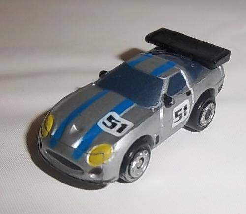 A SILVER RACING CAR WITH NUMBER 51 BY MICRO MACHINES