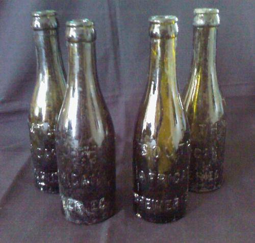AN OLD SETX4 SOUTH AFRICAN BREWERIES GLASS BOTTLES