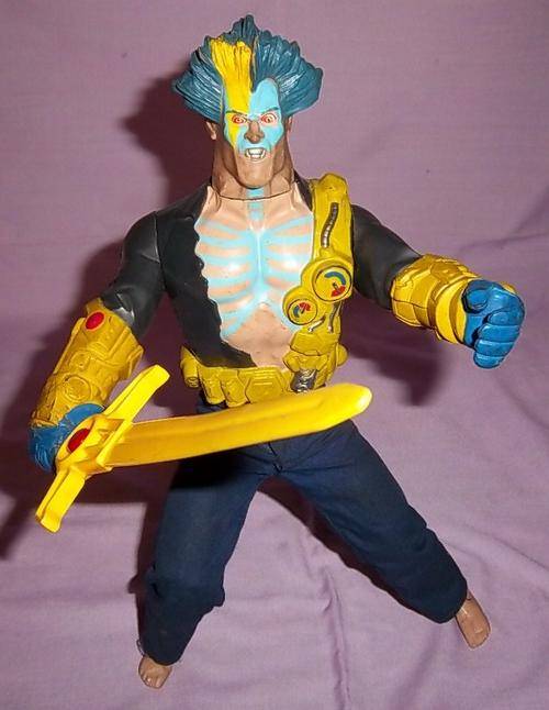 A CRAZY LOOKING FIGURE WITH A SWORD BY HASBRO