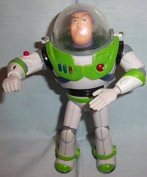 A VINTAGE BUZZ LIGHTYEAR WITH POINTING LAZER BY THINKWAY