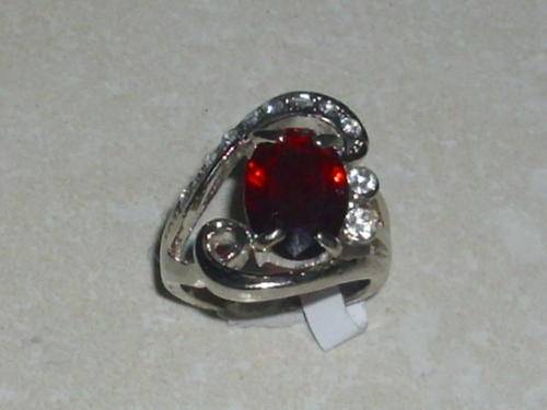 INTERNATIONAL IMPORT SILVER PLATED WITH STUNNING RED STONE AND LOTS OF SIM DIAMONDS SIZE 19