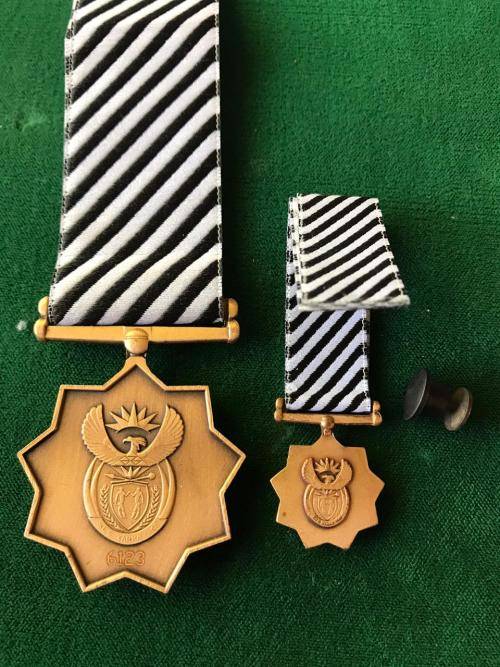 FULL SIZE & MINIATURE MANDELA MEDAL WITH STICK PIN- THE FULL SIZE NUMBERED