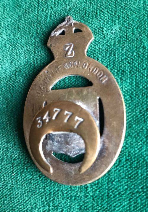 WW1 BRASS,NUMBERED,BUTTON HOLD BADGE