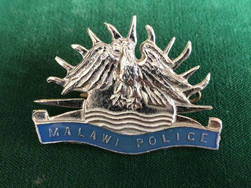 MALAWI POLICE,CHROME + ENAMEL CAP BADGE- 2 LUGS
