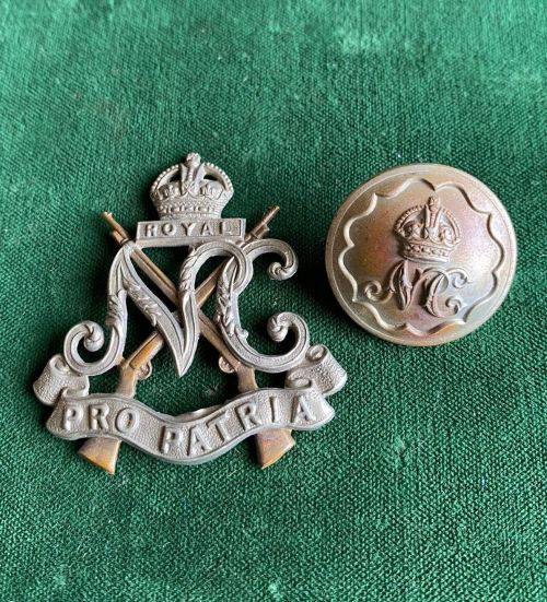 ROYAL NATAL CARBINEERS CAP BADGE,WHITE METAL-WORN 1936-1940-SOLD WITH ONE BUTTON-DIAMETER 150MM-CAP