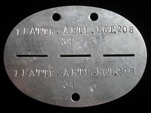 WW2 GERMAN IDENTITY DISC OR DOG TAG-ORIGINAL DIE-STAMPED SINC-IT WAS WORN BY A MEMBER OF 1 BATTERY A