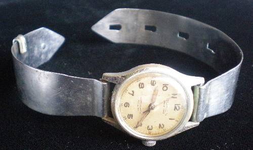 WW2 PERIOD TRENCH ART-A WRIST WATCH WITH THE STRAP MADE FROM AIRCRAFT ALUMINIUM