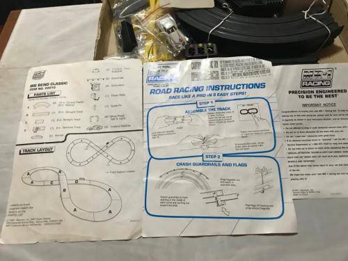 Slot car set with 4 cars. Not tested