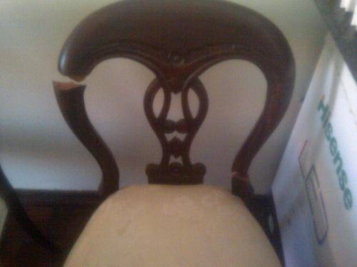 Vintage antique Iroko round dining room table for sale with six chairs.