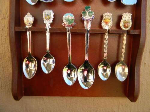 18 Souvenir  spoons  in good condition with free rack  as per pictures