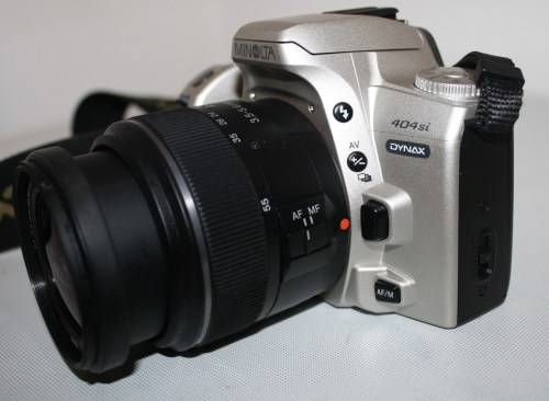 ** Minolta 404si** Sony..DT 3.5-5.6/18-55 SAM Lens...Working..Excellent  Condition
