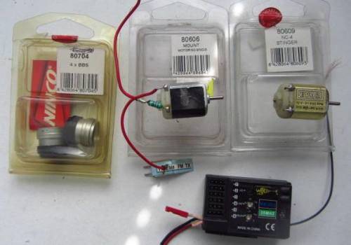 **Slot Cars**..Motors(not sure if correct holder)...Plus Receiver-RX-603-35MHZ-Not Tested