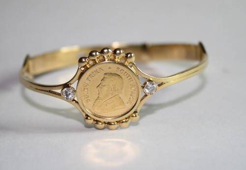 Kruger Rand 1/10 set in 18ct gold bracelet