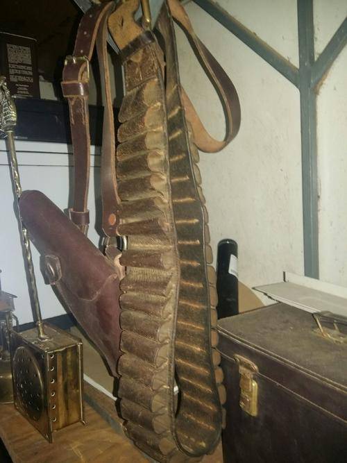 Old ammo belt and gun holster - one bid for both