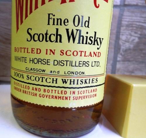SUPER RARE ,,WHITE HORSE WHISKY  sealed bottle ,,,BOTTLED IN THE 1970s,