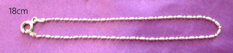 A SOLID SILVER BRACELET CHAIN AND 3 SOLID SILVER CHARMS---NEW