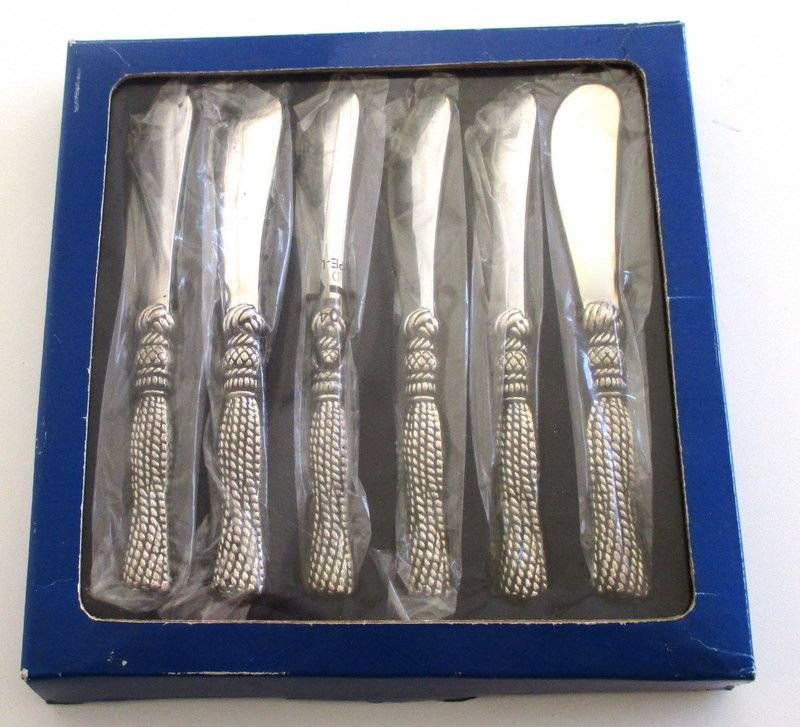A SET OF SIX BUTTER KNIVES IN ORIGINAL UNOPENED PACKAGING