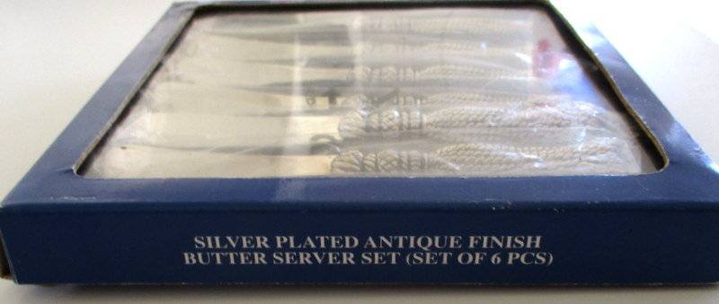 A SET OF SIX BUTTER KNIVES IN ORIGINAL UNOPENED PACKAGING