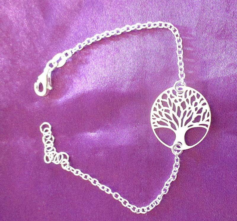 A  SOLID SILVER TREE OF LIFE BRACELET