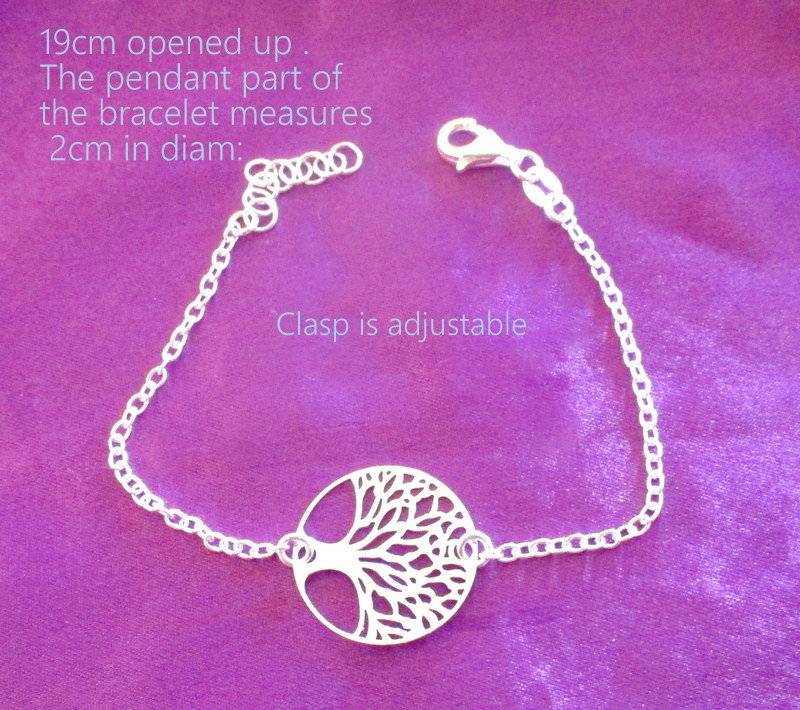 A  SOLID SILVER TREE OF LIFE BRACELET