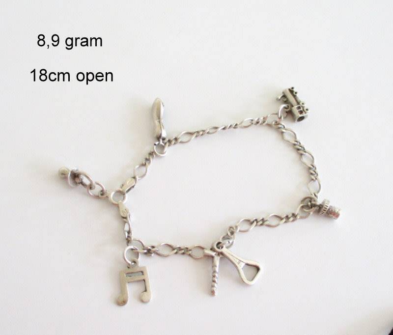 A SOLID SILVER CHARM BRACELET