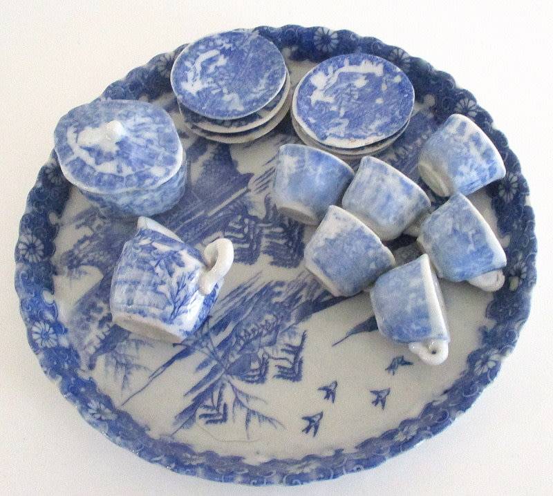 A VICTORIAN SALESMAN'S SAMPLE  PORCELAIN TEA SET ON A TRAY--READ