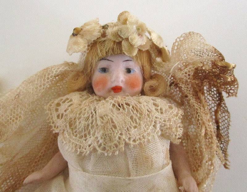AN ANTIQUE PORCELAIN DOLLHOUSE DOLL--As found--Doll perfect