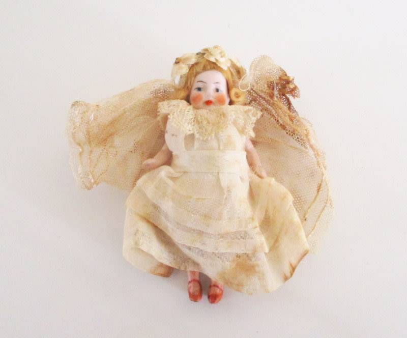 AN ANTIQUE PORCELAIN DOLLHOUSE DOLL--As found--Doll perfect
