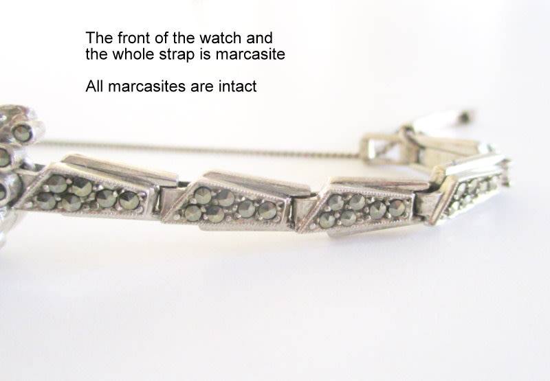 A STERLING SILVER MARCASITE (ALL INTACT) WATCH IN WORKING ORDER AND KEEPING TIME