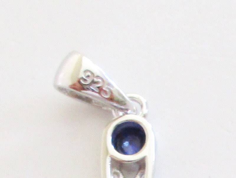 A STERLING ,925 SILVER CROSS