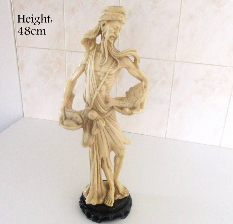 A LARGE ORIENTAL FIGURE OF A FISHERMAN---Signed