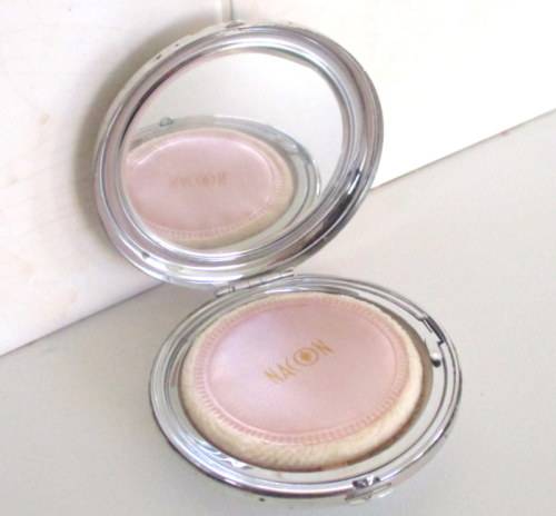 AN ENAMEL AND BRASS PERFUME BOTTLE PENDANT,AN UNUSED POWDER COMPACT ETC