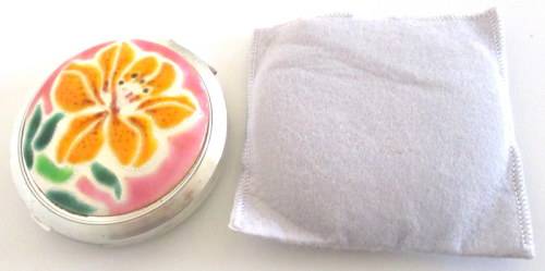 AN ENAMEL AND BRASS PERFUME BOTTLE PENDANT,AN UNUSED POWDER COMPACT ETC