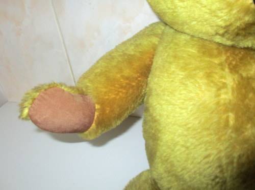 A VINTAGE PLUSH TEDDY BEAR--MAY BE A MERRYTHOUGHT