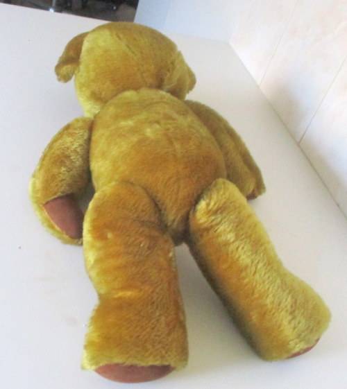 A VINTAGE PLUSH TEDDY BEAR--MAY BE A MERRYTHOUGHT