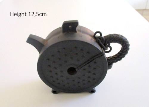 A METAL AND CERAMIC TEA POT AND A POTTERY TEA POT