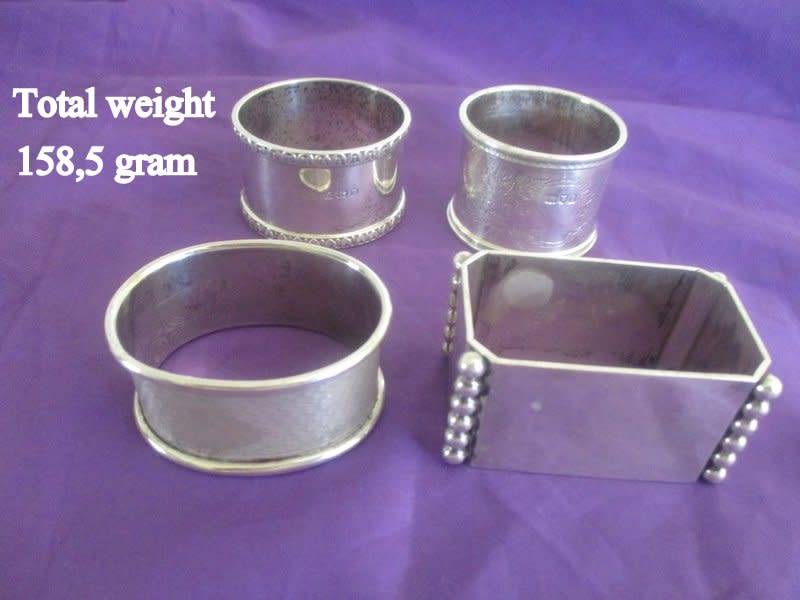4 HALLMARKED SILVER SERVIETTE RINGS. ONE IS SIGNED--NO IRREGULARITIES--Total weight 158,5 gram