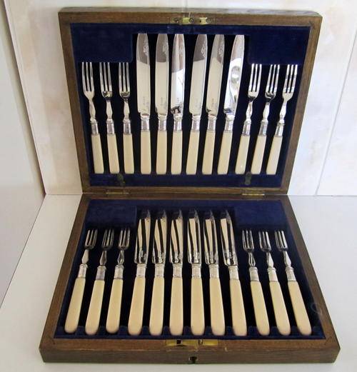 A STUNNING SET OF 24 SILVER PLATED FRUIT KNIVES AND FORKS