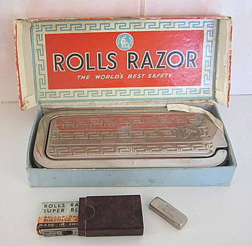 A ROLLS RAZOR IN ORIGINAL BOX AND CONTAINER
