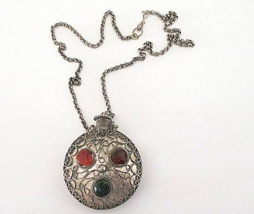 A METAL PERFUME BOTTLE WITH SEMI-PRECIOUS STONES