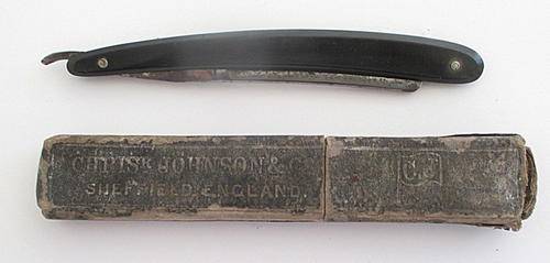 A CUT THROAT RAZOR MADE IN SHEFFIELD