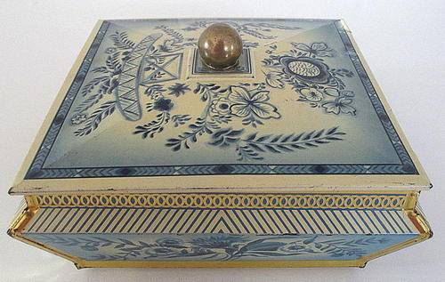 A VINTAGE BLUE AND WHITE TIN