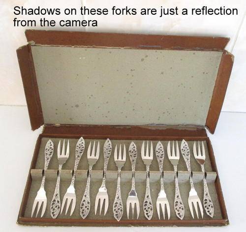 A SET OF 12 BOXED SMALL DUTCH FORKS