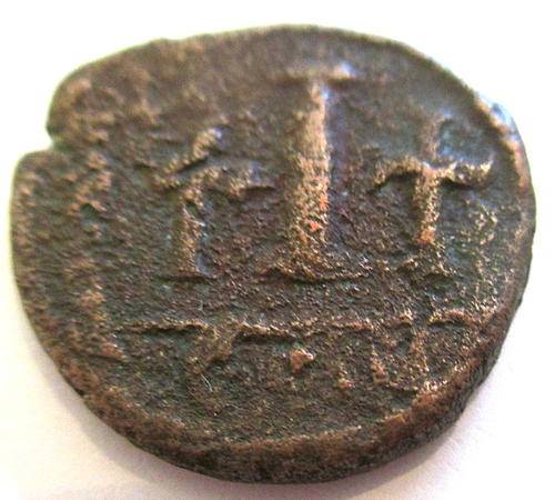 AN ANCIENT COIN  JUSTINIA IN NUMIDIA--ROUND 575 AD --Over 1400 years old
