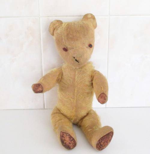 A 1950's MOHAIR  (WELL LOVED) TEDDY BEAR--FOR REPAIR